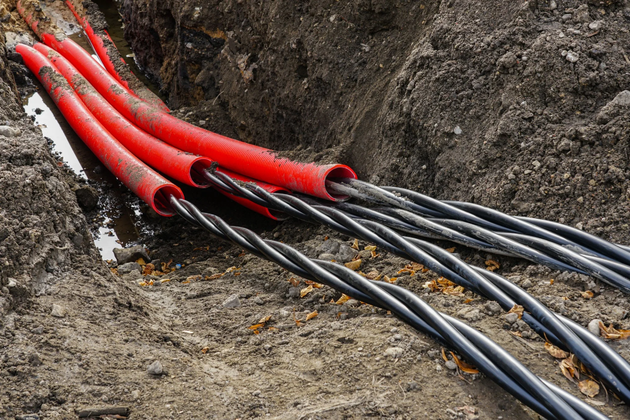 Underground MV cable installation in a trench.
